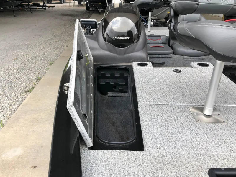Slide: The Image of 2021 Bass Tracker PRO TEAM 175 TXW boat with open storage compartment and seating. - 15