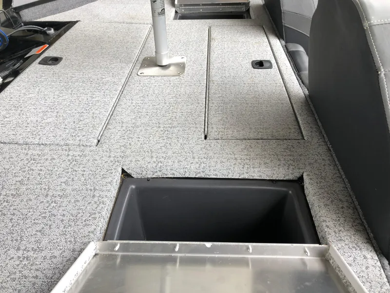 Slide: The Image of 2021 Bass Tracker PRO TEAM 175 TXW interior with storage compartments. - 17