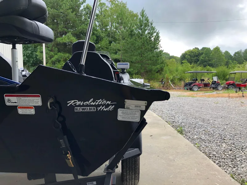 Slide: The Image of 2021 Bass Tracker PRO TEAM 175 TXW boat with Revolution Hull, parked outdoors. - 21