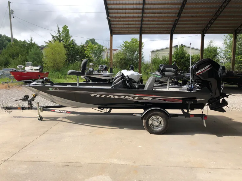 Slide: The Image of 2021 Bass Tracker PRO TEAM 175 TXW boat on trailer, parked outdoors. - 3