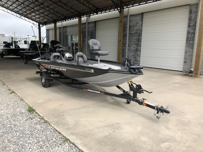 Slide: The Image of 2021 Bass Tracker PRO TEAM 175 TXW boat parked under a canopy. - 4