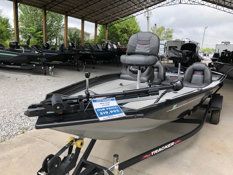 Slide: The Image of 2021 Bass Tracker PRO TEAM 175 TXW boat displayed for sale under a canopy. - 7