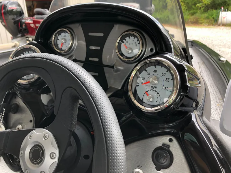 Slide: The Image of Dashboard of 2021 Bass Tracker PRO TEAM 175 TXW boat with steering wheel and gauges. - 9