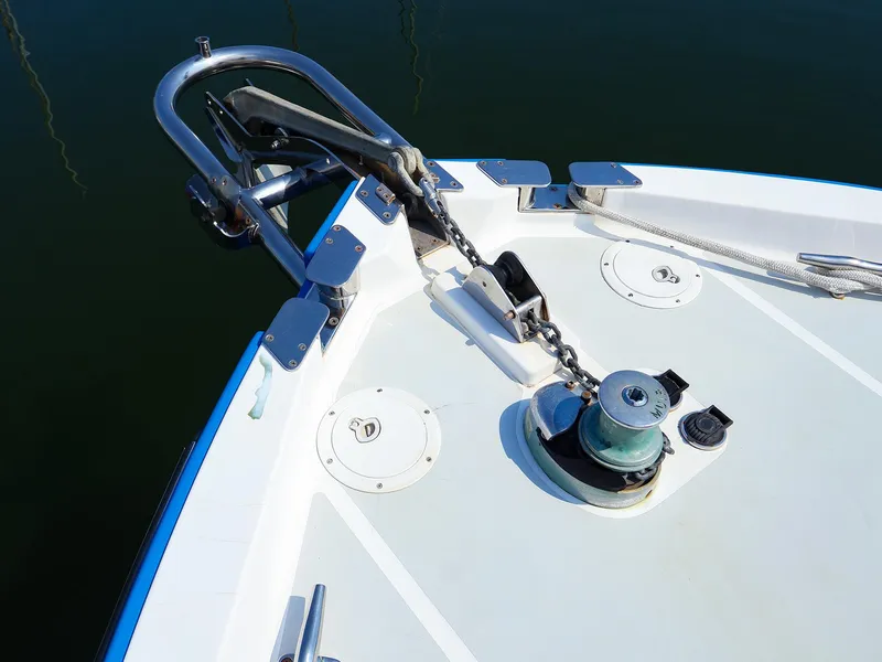 Slide: The Image of Bow of 2004 True North 38 boat with anchor chain and winch. - 23