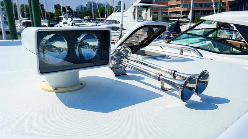 Slide: The Image of Rooftop of 2004 True North 38 boat with spotlight and dual trumpet horns. - 26
