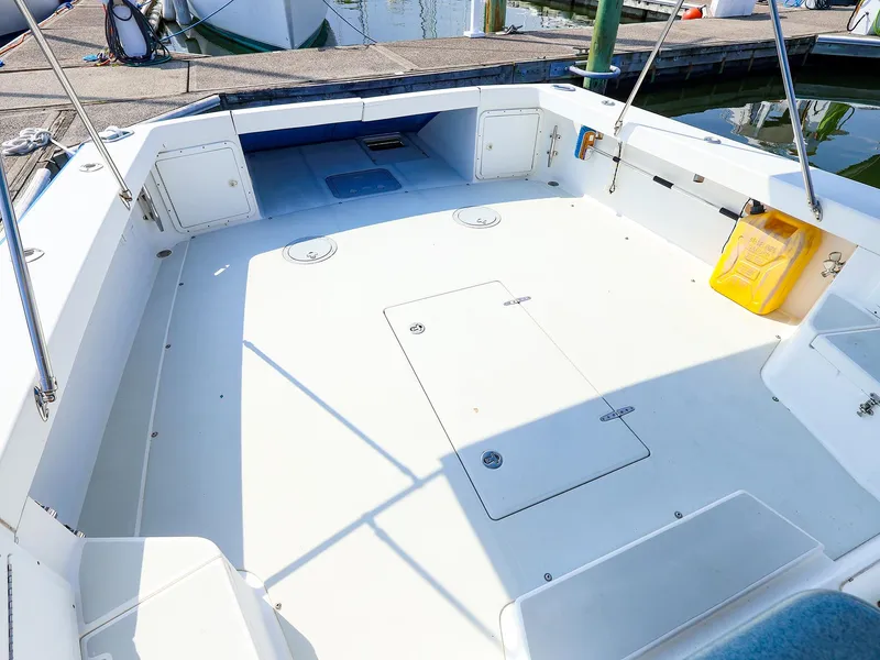 Slide: The Image of Spacious deck of 2004 True North 38 boat at marina. - 3