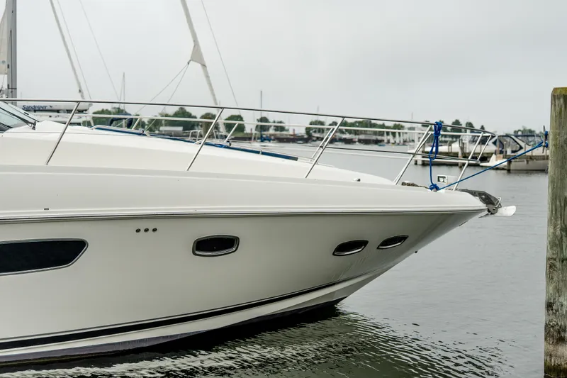 Slide: The Image of 2009 Sea Ray 470 Sundancer yacht docked at marina, side view. - 14