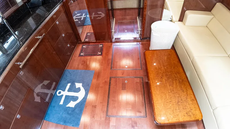 Slide: The Image of Luxurious interior of 2009 Sea Ray 470 Sundancer yacht with wooden flooring and anchor-themed decor. - 30