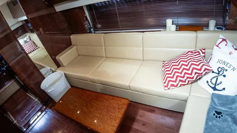 Slide: The Image of Luxurious interior of 2009 Sea Ray 470 Sundancer with beige sofa and decorative pillows. - 31