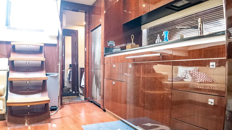 Slide: The Image of Luxurious interior of 2009 Sea Ray 470 Sundancer yacht with modern kitchen and wooden stairs. - 35
