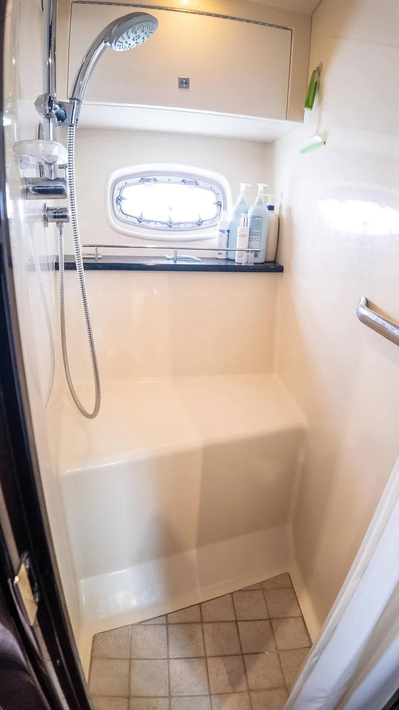Slide: The Image of Shower area in 2009 Sea Ray 470 Sundancer yacht with handheld showerhead and window. - 41