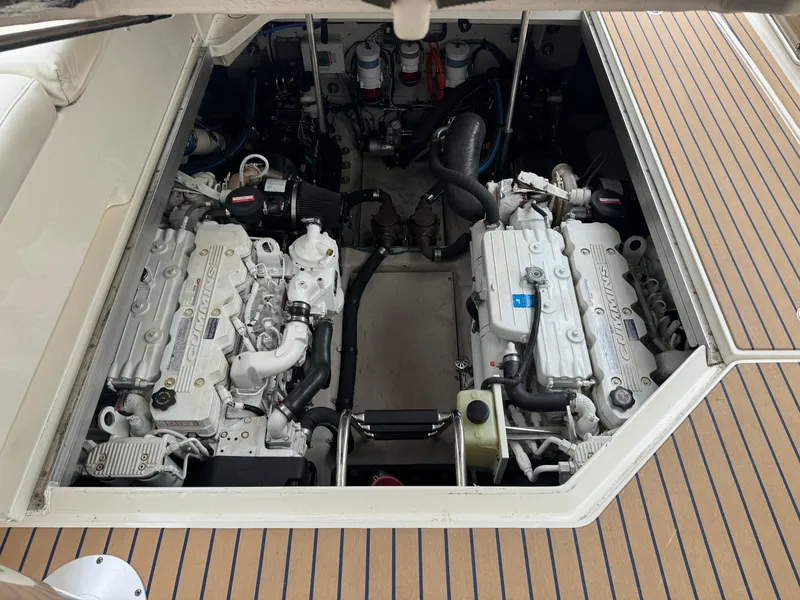 Slide: The Image of Engine compartment of 2009 Sea Ray 470 Sundancer with Cummins engines visible. - 48