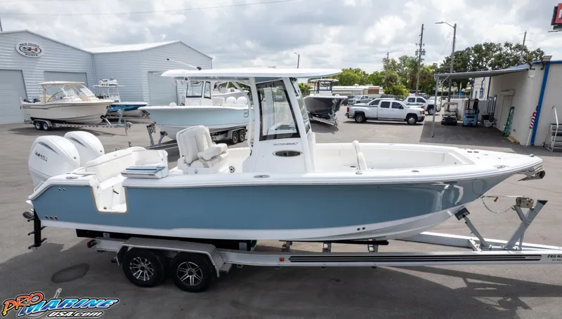 Slide: The Image of 2026 Sea Hunt Ultra 265 SE boat on trailer at dealership. - 10