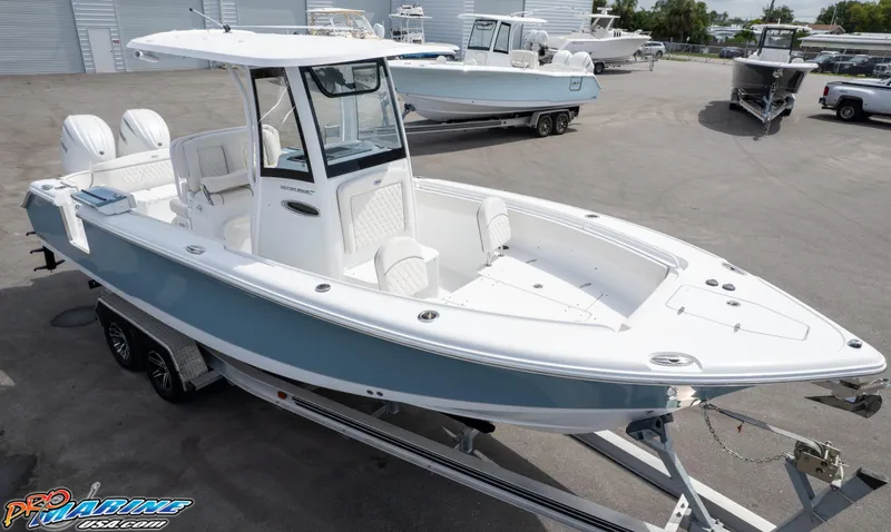 Slide: The Image of 2026 Sea Hunt Ultra 265 SE boat on trailer, displayed outdoors. - 12
