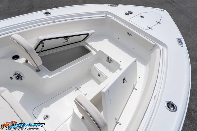 Slide: The Image of 2026 Sea Hunt Ultra 265 SE boat interior with open storage compartment. - 17