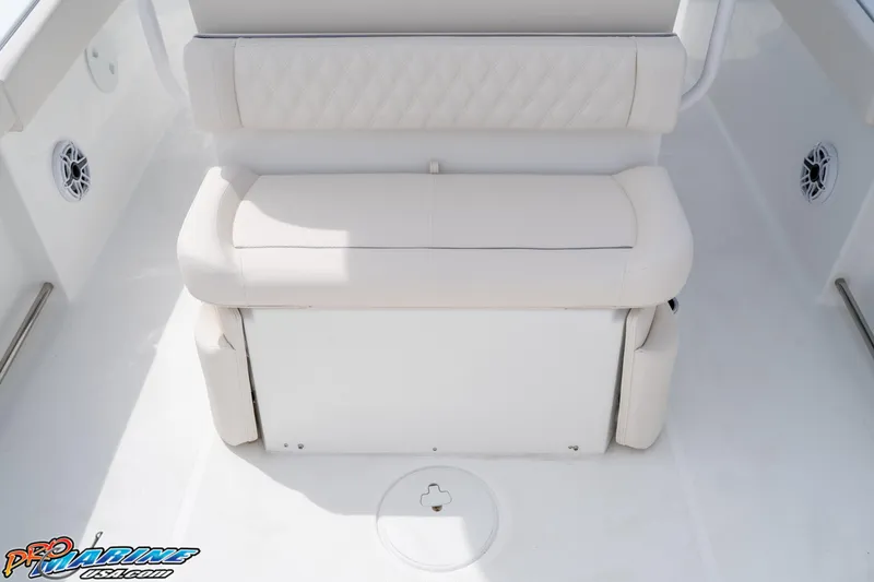 Slide: The Image of 2026 Sea Hunt Ultra 265 SE boat seating area with white cushioned bench. - 28