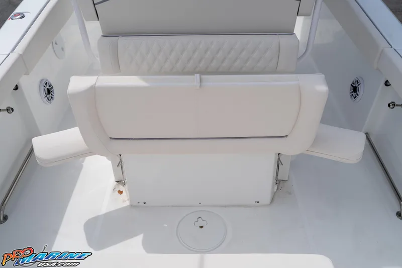 Slide: The Image of 2026 Sea Hunt Ultra 265 SE boat interior with white cushioned seating. - 29