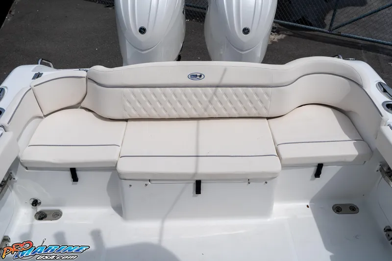 Slide: The Image of 2026 Sea Hunt Ultra 265 SE boat with white cushioned seating. - 34