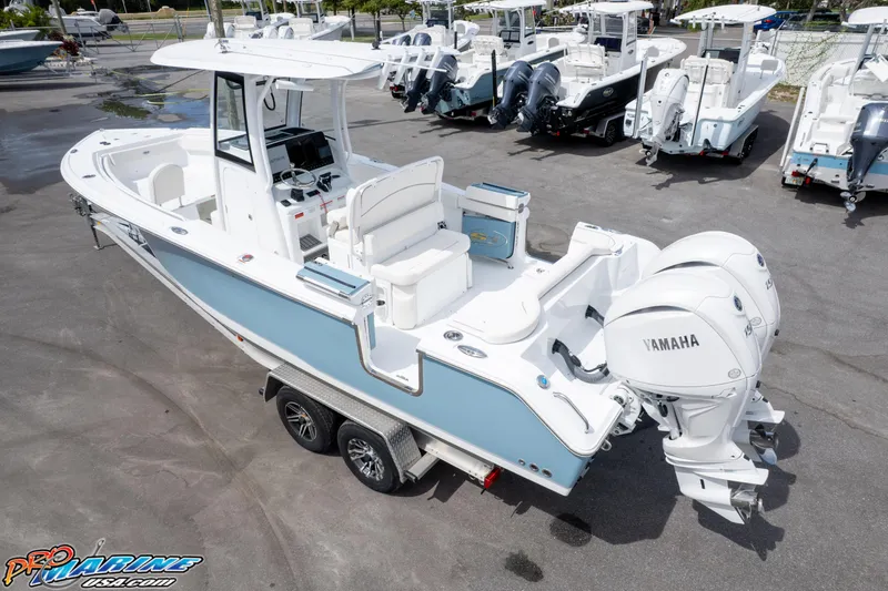 Slide: The Image of 2026 Sea Hunt Ultra 265 SE boat with dual Yamaha engines on a trailer. - 4