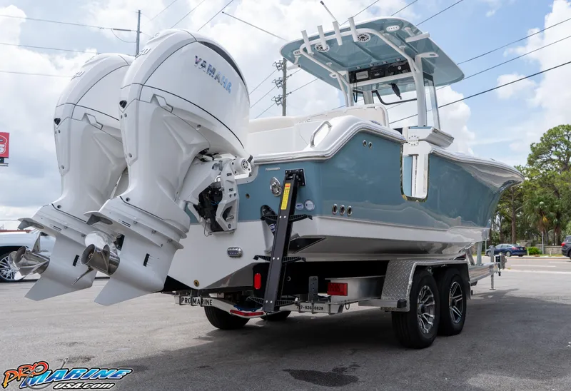 Slide: The Image of 2026 Sea Hunt Ultra 265 SE boat with dual Yamaha outboard engines on a trailer. - 7