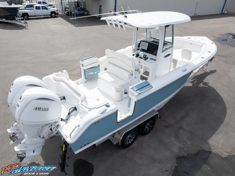 Slide: The Image of 2026 Sea Hunt Ultra 265 SE boat with dual Yamaha engines on a trailer. - 8