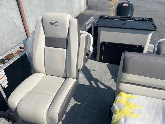 Slide: The Image of 2026 Sun Tracker Fishin' Barge 20 DLX interior with comfortable seating and modern design. - 14