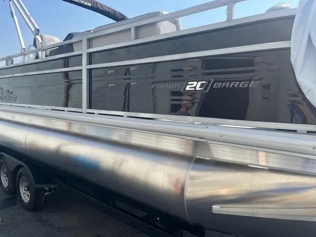 Slide: The Image of 2026 Sun Tracker Fishin' Barge 20 DLX pontoon boat, side view, on trailer. - 5