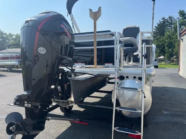 Slide: The Image of 2026 Sun Tracker Fishin' Barge 20 DLX pontoon boat with powerful outboard motor. - 7