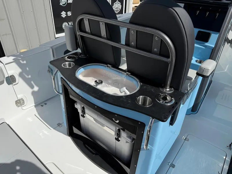 Slide: The Image of 2026 Sea Pro 262 Offshore boat interior with seating and storage features. - 13