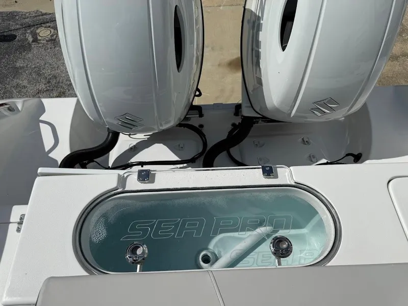 Slide: The Image of 2026 Sea Pro 262 Offshore boat with dual outboard engines and livewell. - 15