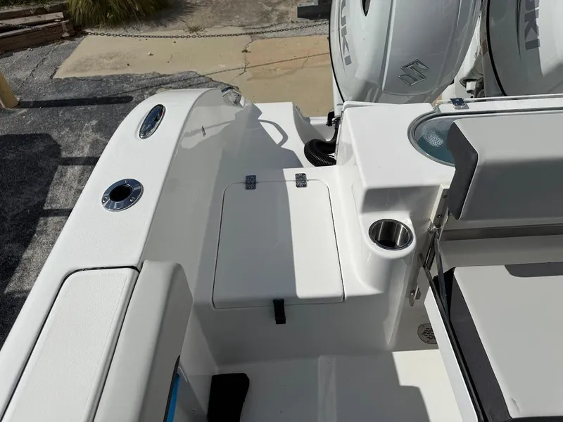 Slide: The Image of 2026 Sea Pro 262 Offshore boat interior with seating and storage compartments. - 16