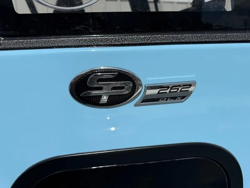 Slide: The Image of 2026 Sea Pro 262 Offshore boat emblem on light blue surface. - 18