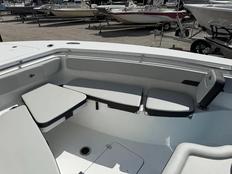 Slide: The Image of 2026 Sea Pro 262 Offshore boat interior with cushioned seating and table. - 23
