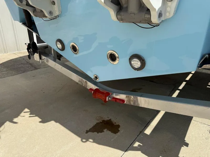 Slide: The Image of 2026 Sea Pro 262 Offshore boat on trailer, showing rear hull and engine mounts. - 9