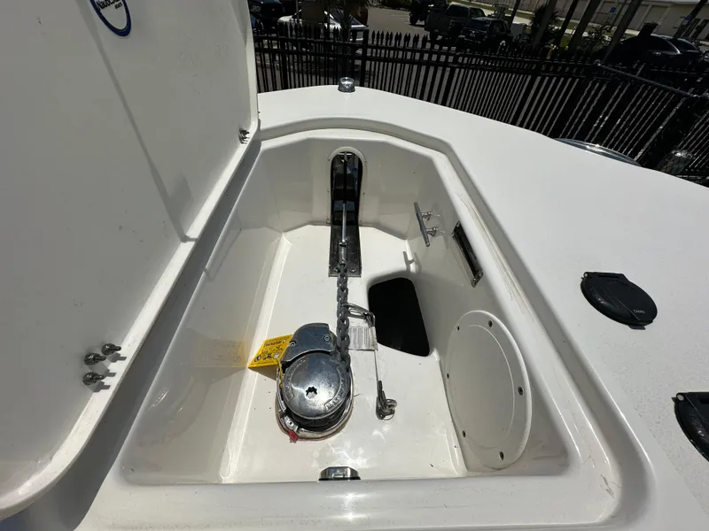 Slide: The Image of 2021 NauticStar 28XS anchor compartment with chain and winch system. - 27