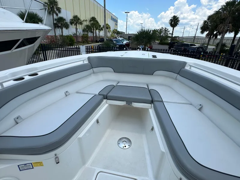 Slide: The Image of 2021 NauticStar 28XS boat interior with gray seating and spacious layout. - 41