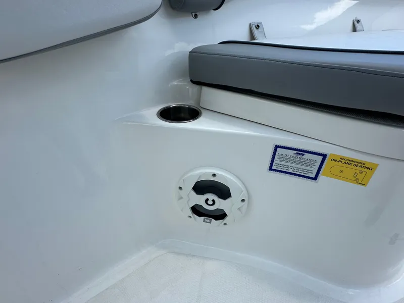 Slide: The Image of Interior of 2021 NauticStar 28XS boat with seating and cup holder. - 42