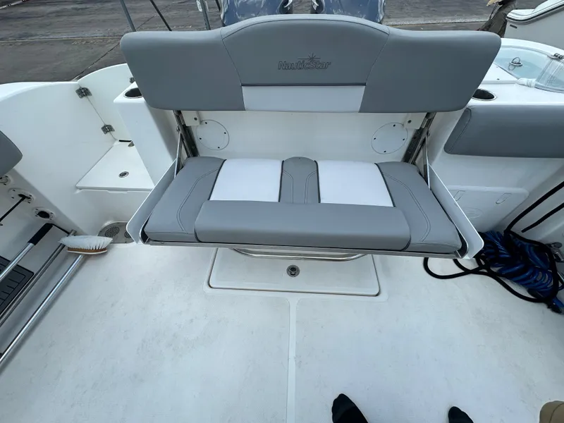 Slide: The Image of 2021 NauticStar 28XS boat seat with gray and white upholstery. - 44