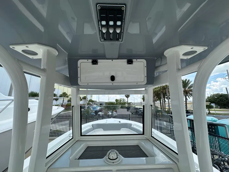 Slide: The Image of Interior view of 2021 NauticStar 28XS boat, showcasing helm and controls. - 47