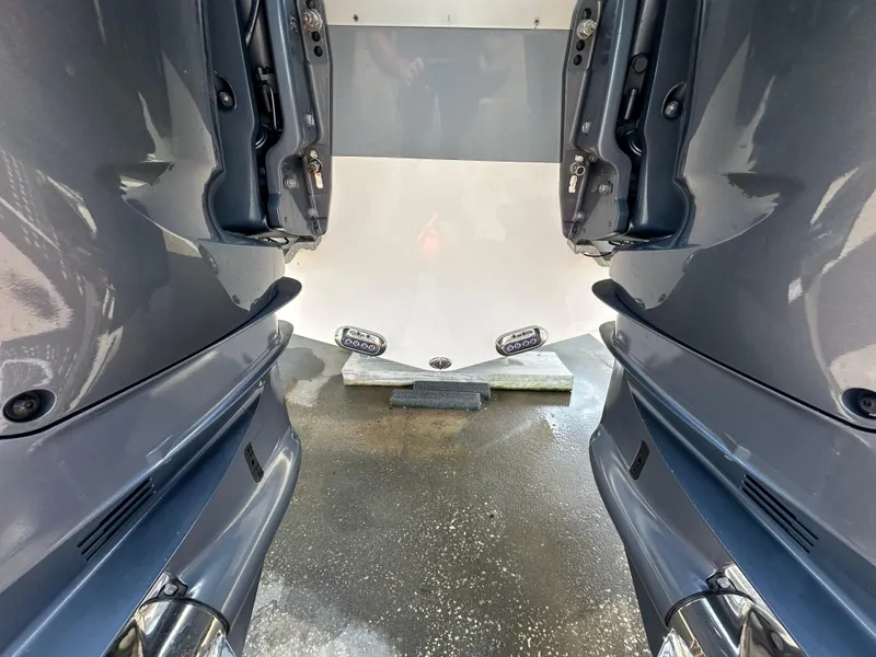 Slide: The Image of 2021 NauticStar 28XS boat engines and transom close-up view. - 9