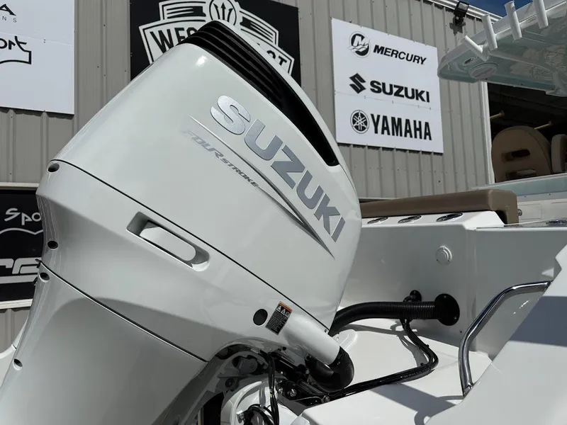 Slide: The Image of 2026 Sea Pro 292 Offshore with Suzuki outboard motor, displayed at dealership. - 10