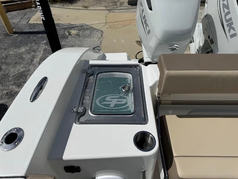 Slide: The Image of 2026 Sea Pro 292 Offshore boat deck with Suzuki engines and seating area. - 13