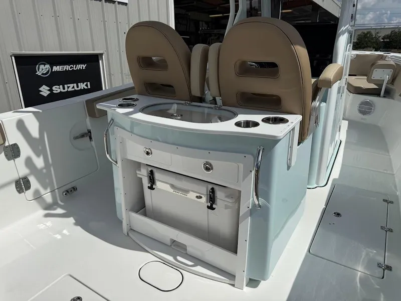 Slide: The Image of 2026 Sea Pro 292 Offshore boat interior with seating and storage features. - 16