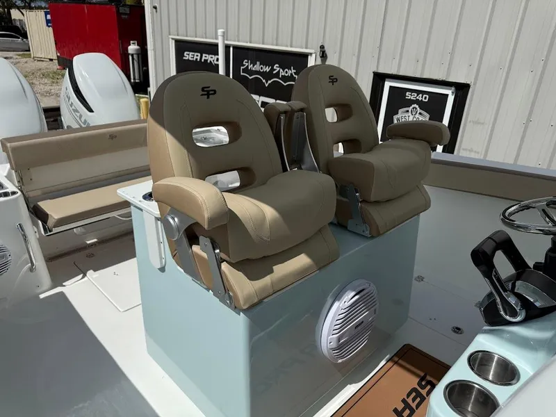 Slide: The Image of 2026 Sea Pro 292 Offshore boat interior with dual captain's chairs and steering wheel. - 17