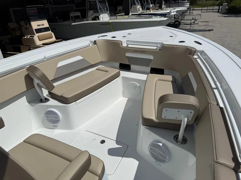 Slide: The Image of 2026 Sea Pro 292 Offshore boat interior with beige seating and speakers. - 19