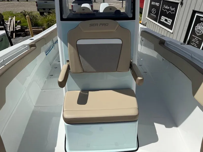 Slide: The Image of 2026 Sea Pro 292 Offshore boat seat with beige upholstery and armrests. - 21