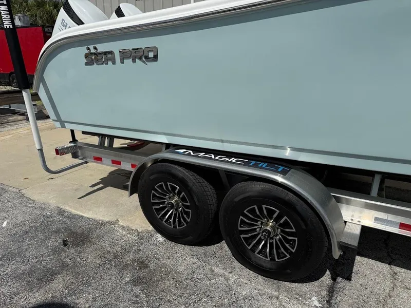 Slide: The Image of 2026 Sea Pro 292 Offshore boat on Magic Tilt trailer, side view. - 6