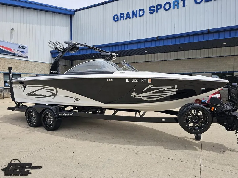 Slide: The Image of 2014 Tigé Z3 boat on trailer outside Grand Sport Center. - 13