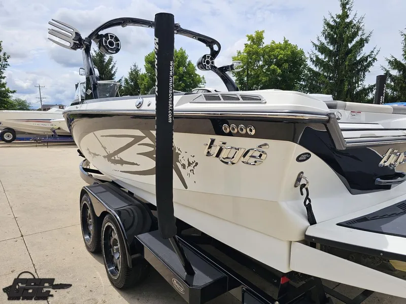 Slide: The Image of 2014 Tigé Z3 boat on trailer, featuring sleek design and modern wakeboard tower. - 28