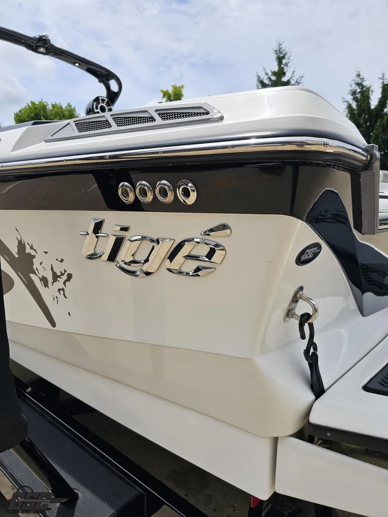 Slide: The Image of 2014 Tigé Z3 boat rear view with logo and sleek design. - 29